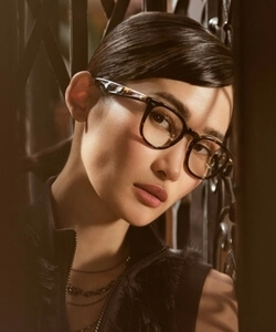 asian woman wearing oliver peoples 250x300