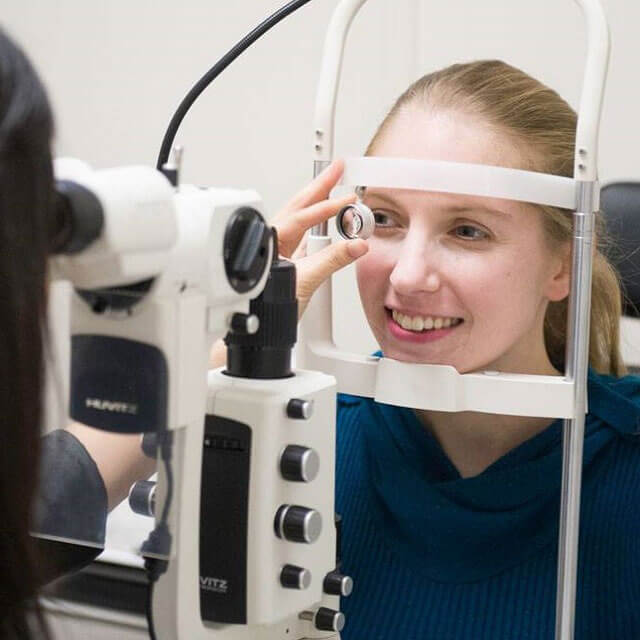 woman optometrist eye exam opt