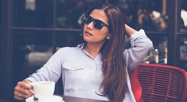 woman wearing sunglasses at a coffeeshop 640.jpg