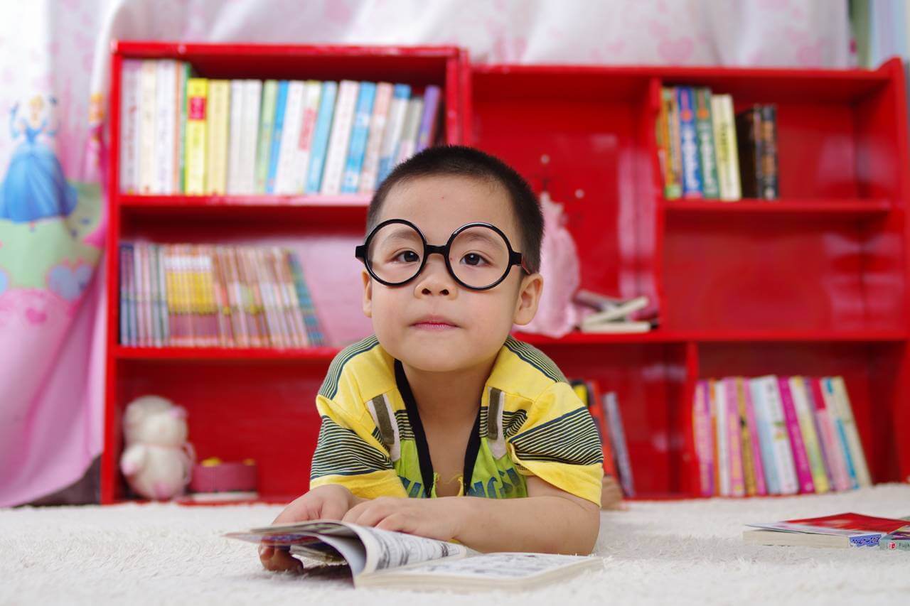 boy glasses red bookcase 1280×853