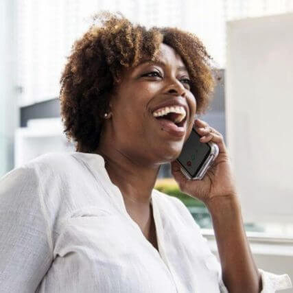 HAPPY BLACK WOMAN TALKING On THE PHONE
