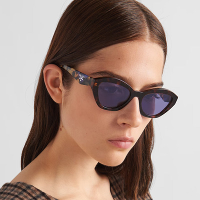 woman wearing purple prada sunglasses