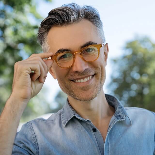 urban professional man modeling eyeglasses in park