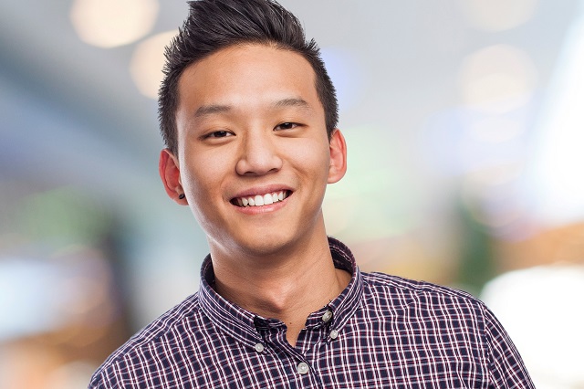 happy asian young man plaid shirt