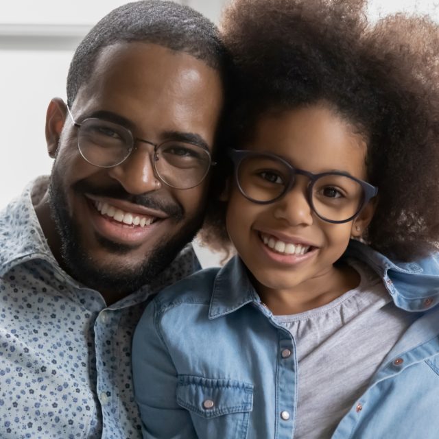 happy father daughter wearing eyeglasses