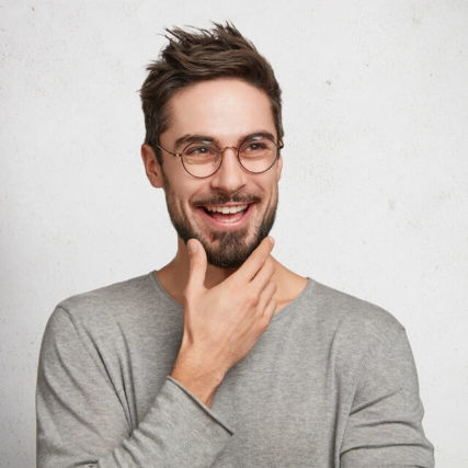 man smiling wearing glasses