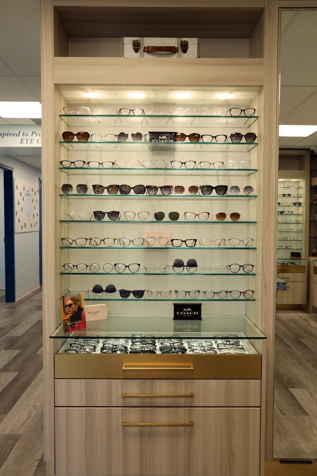 designer eyeglasses on a shelf