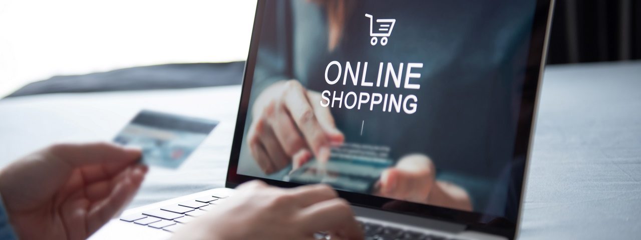 shop online hand laptop credit card