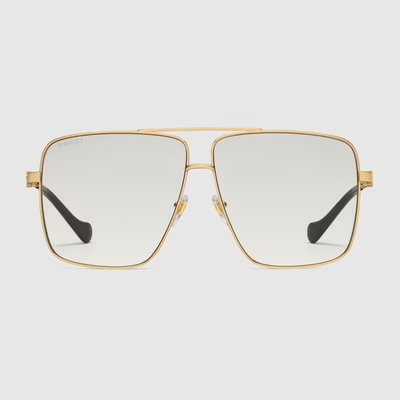 pair of golden rimmed gucci eyeglasses 400x400