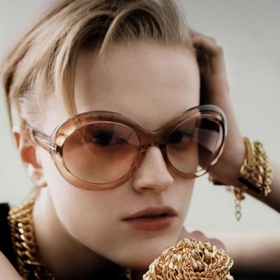 woman wearing golden tom ford sunglasses