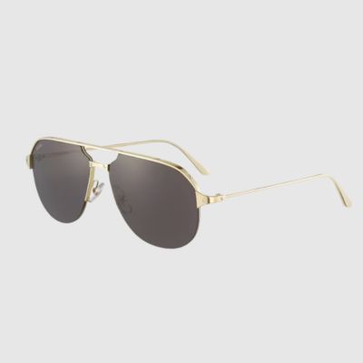 pair of gold rimed cartier sunglasses