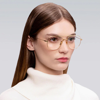 woman wearing gold dita eyeglasses