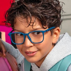 boy wearing blue puma kids eyeglasses