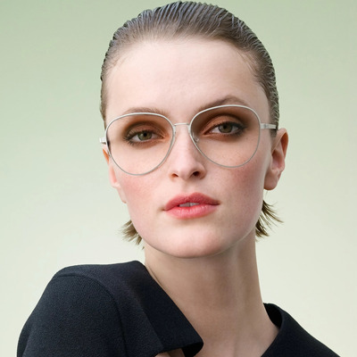 woman wearing silver lindberg eyeglasses