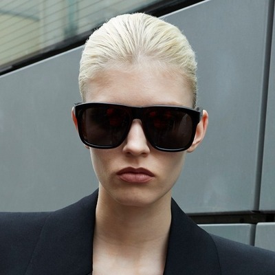 woman wearing square shaped saint laurent sunglasses