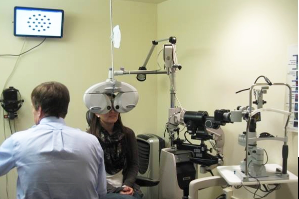 Dr Aller and patient eye exam