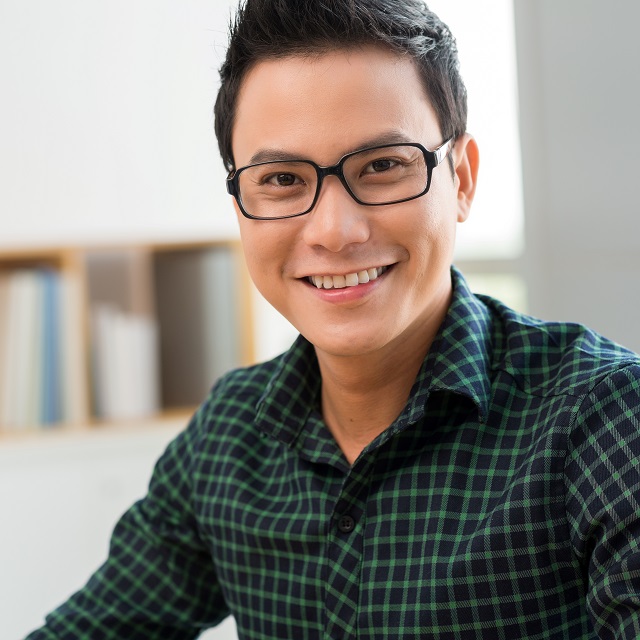 happy asian man modeling eyeglasses