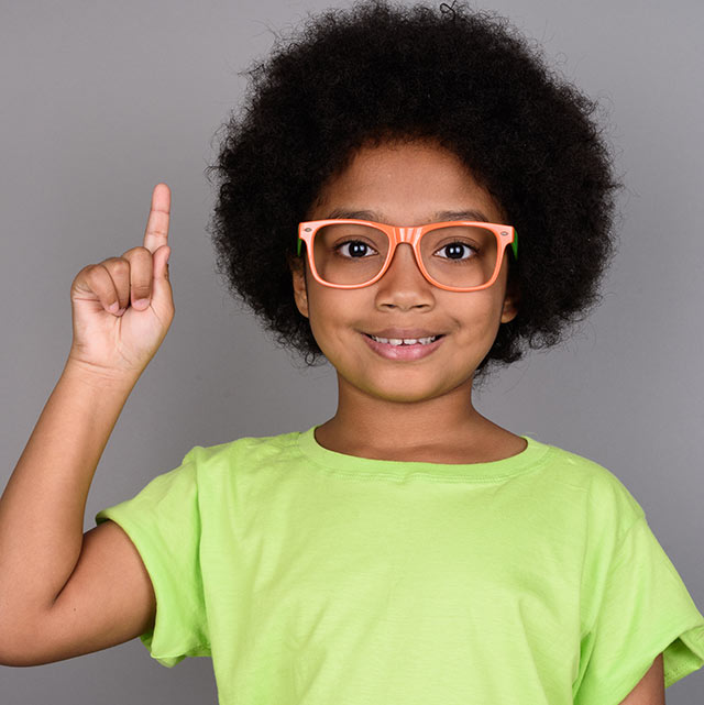 Girl frizzy hair pointing up wearing glasses
