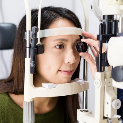 young woman comprehensive eye exam