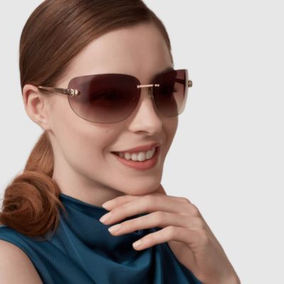 woman wearing oval shaped cartier sunglasses