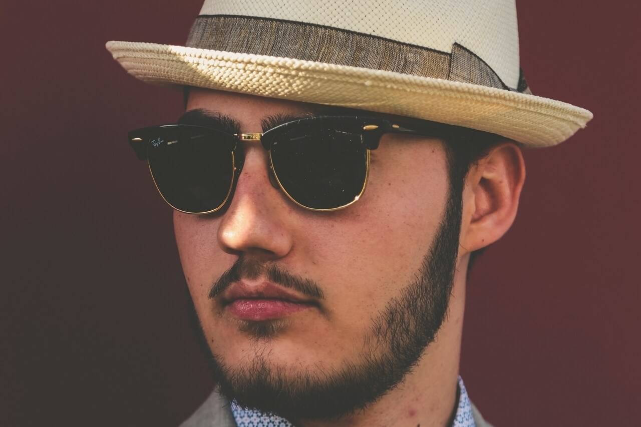 young man hat sunglasses 1280x853
