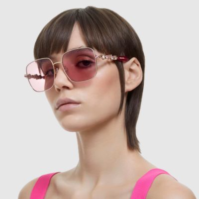 woman wearing pink swarovski sunglasses