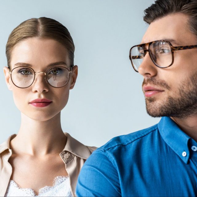 close up portrait of young man and woman in stylish clothing and