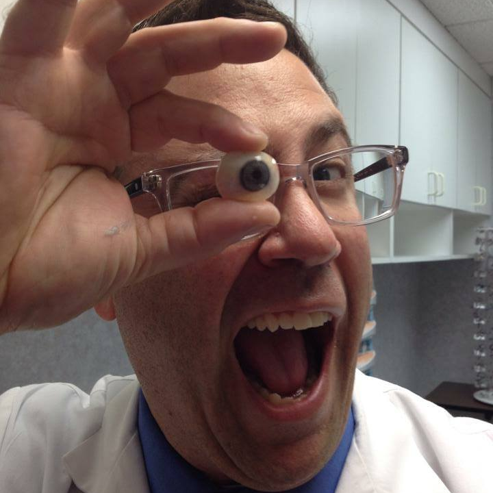 eye doctor holding an eyeball