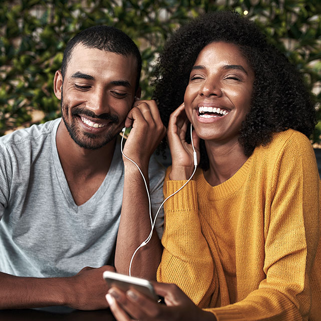 Afro American Couple Listening to Podcast