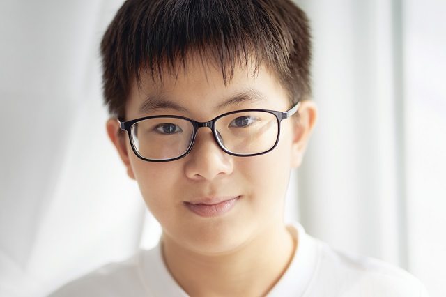 young asian boy wearing eyeglasses