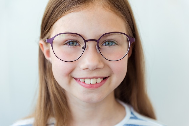 Young girl portrait modeling eyeglasses