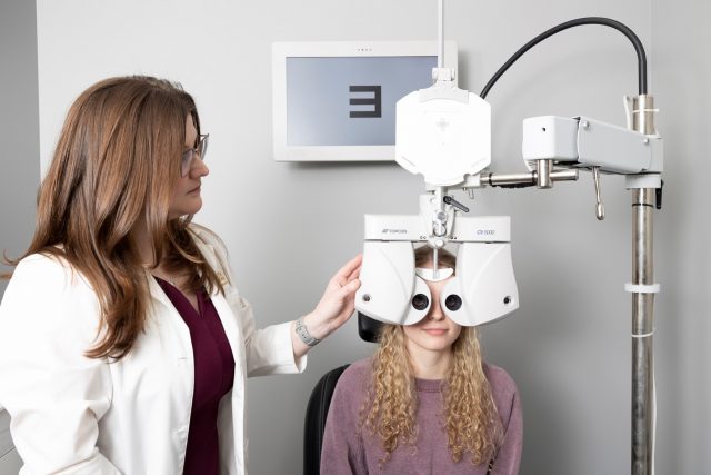 young woman having eye exam