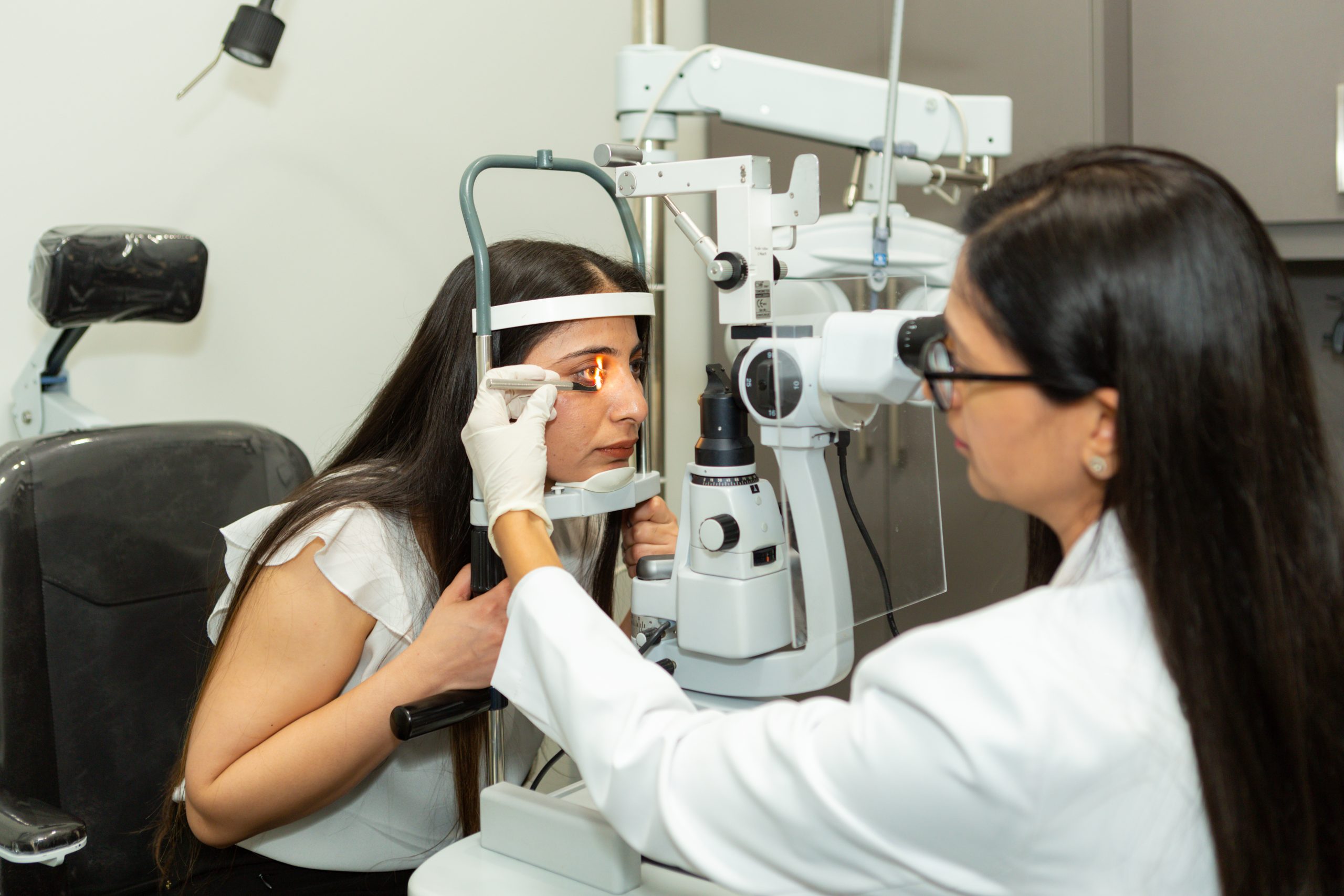 Optometrist checking eyes
