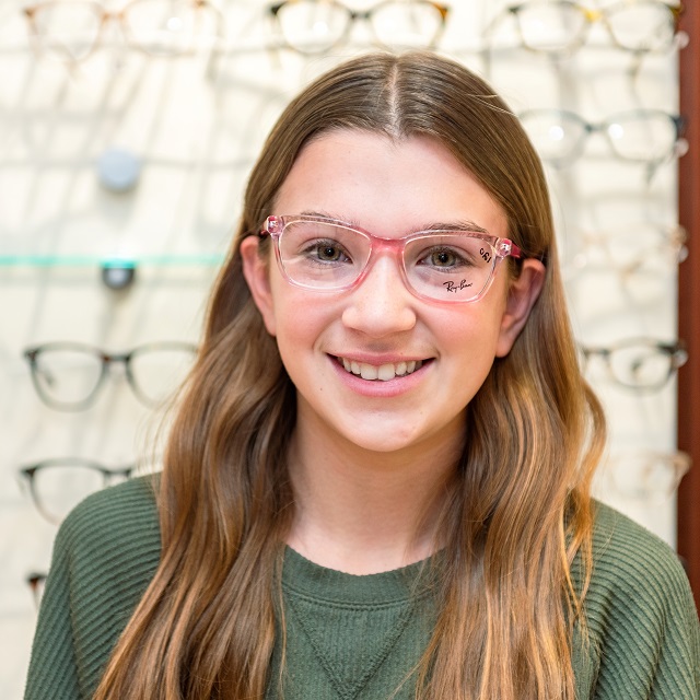 young girl wearing Ray Ban eyeglasses