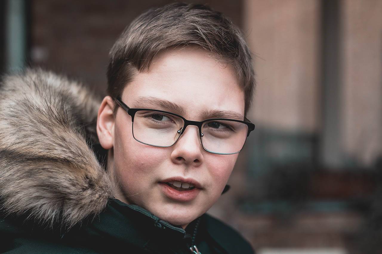 boy with glasses winter coat