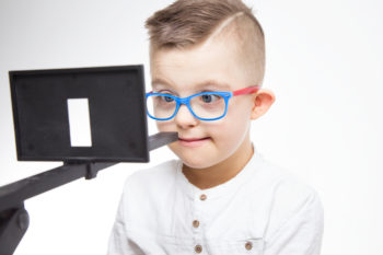 young boy vision therapy exercise