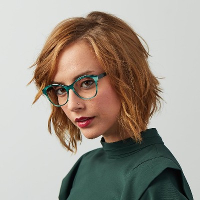 woman wearing green bevel eyeglasses