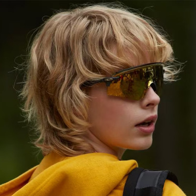 boy wearing gold oakley youth sunglasses
