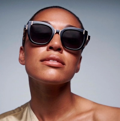 Black woman wearing face a face sunglasses