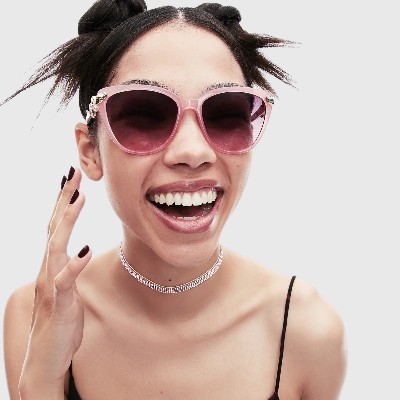 young woman wearing pink betsey johnson sunglasses