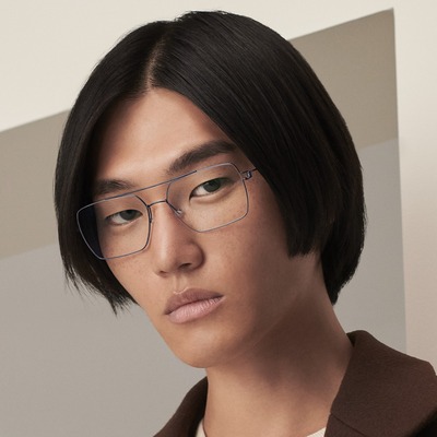 asian man wearing lindberg eyeglasses