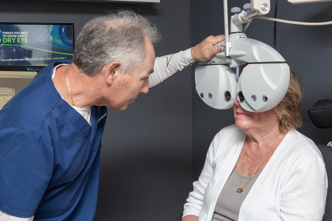 Dr. Ronald Cauchard and patient eye exam