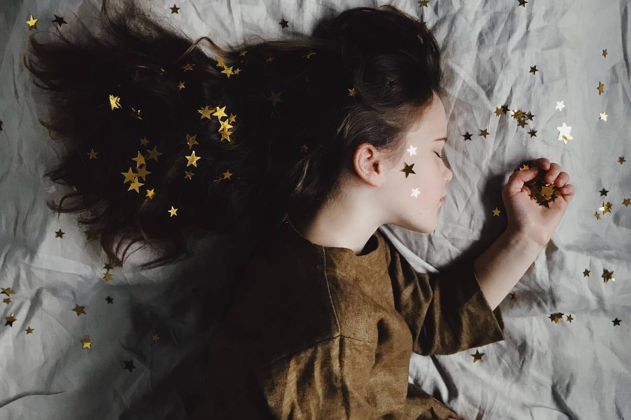 sleeping girl with gold star