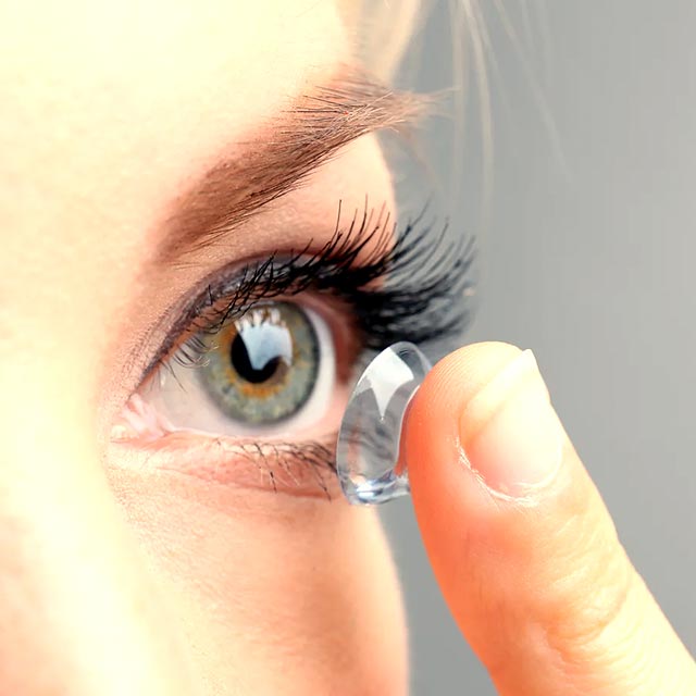 Female Fitting Contact Lenses Close Up