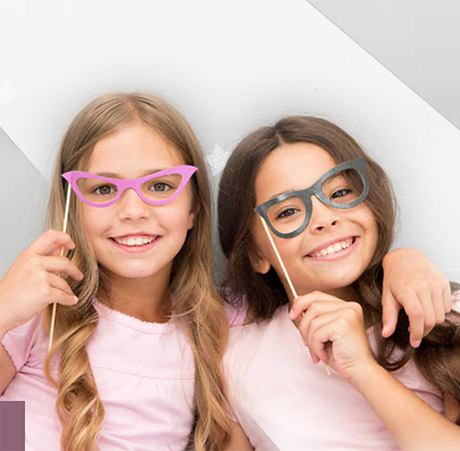 children in pink with eyeglasses