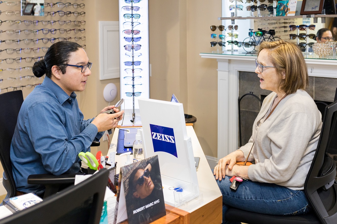 Optician and patient discussing eyewear