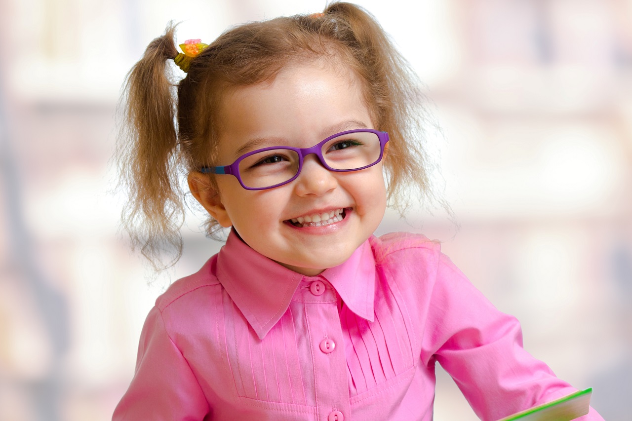 happy young girl wearing eyeglasses