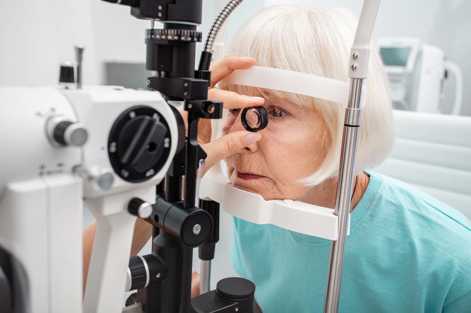 Checking retina of a female eye close-up.