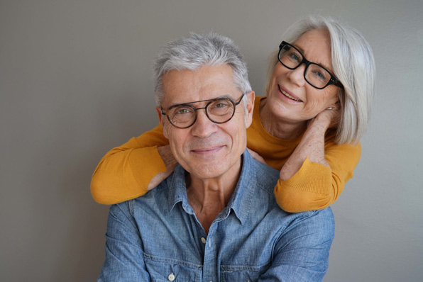 Middle Aged Couple Wearing Eyeglasses