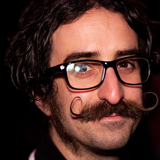 Man with glasses and curly mustache